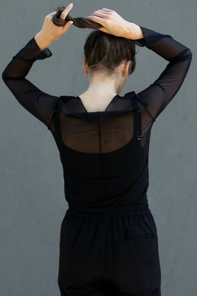 Back view of black sheer mesh round neck long sleeved top designed by Wendy Voon, featuring centre back seam detail.