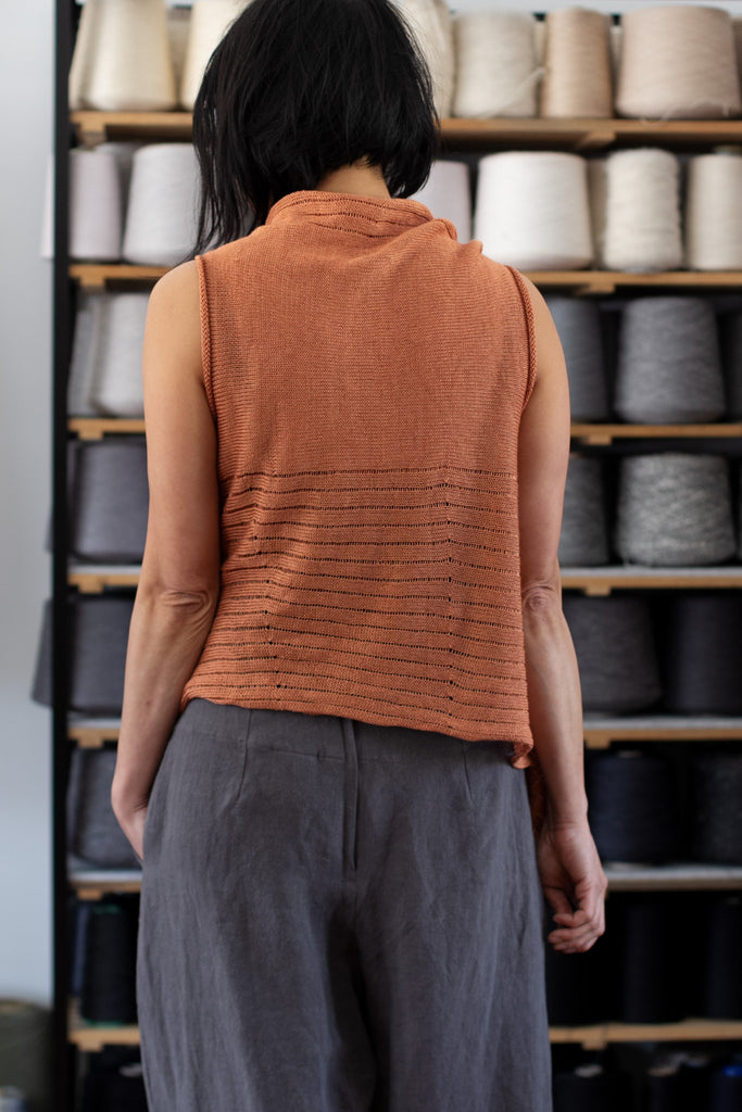 Back view of Linen Laddered Vest design by Wendy Voon knits in linen, showing laddered fabric design detail, in sienna colourway