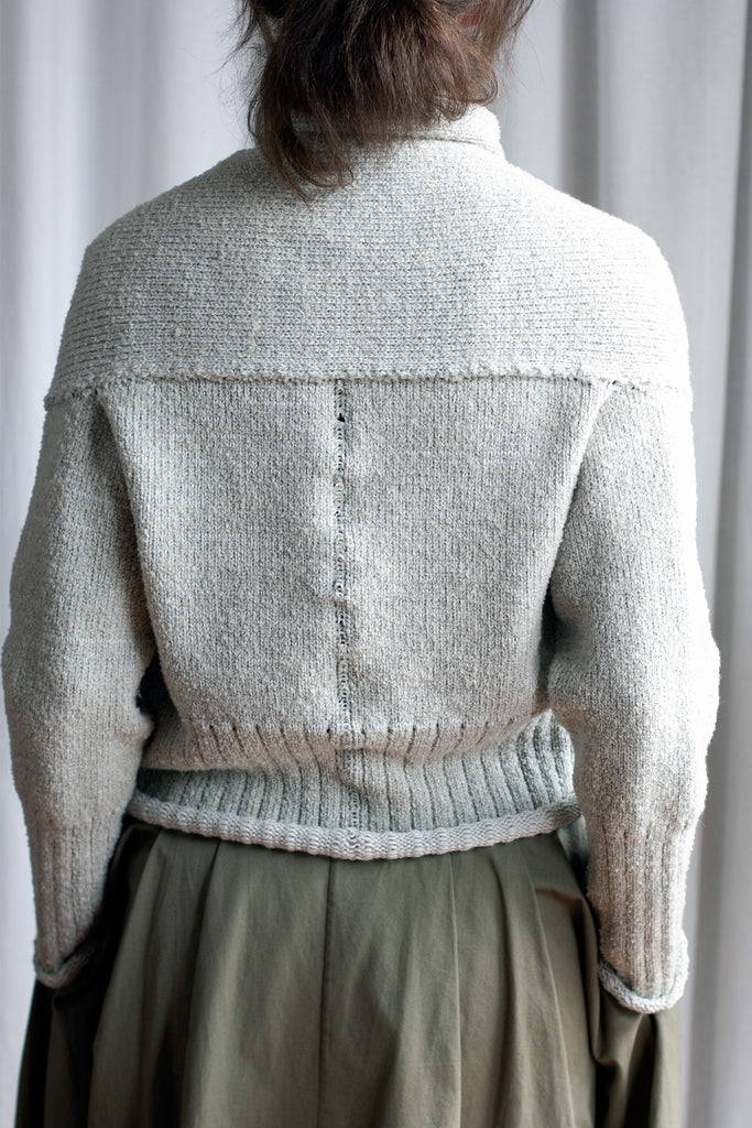 Back view of off white superfine merino wool cardi, with ruched detail around the neck, designed and made by Wendy Voon knits.