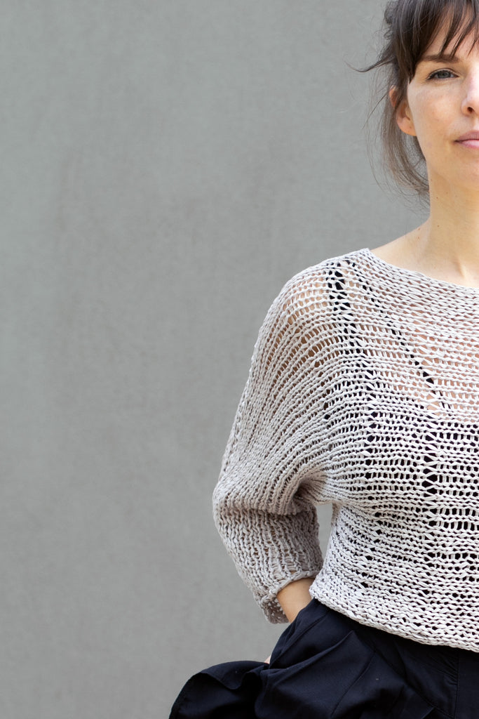 Partial view of Large Stitch Batwing jumper, knitted  in Pearl cotton and designed by Wendy Voon
