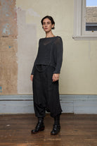 Front view of loose cord knit batwing in charcoal, designed by Wendy Voon knits and made in Melbourne.