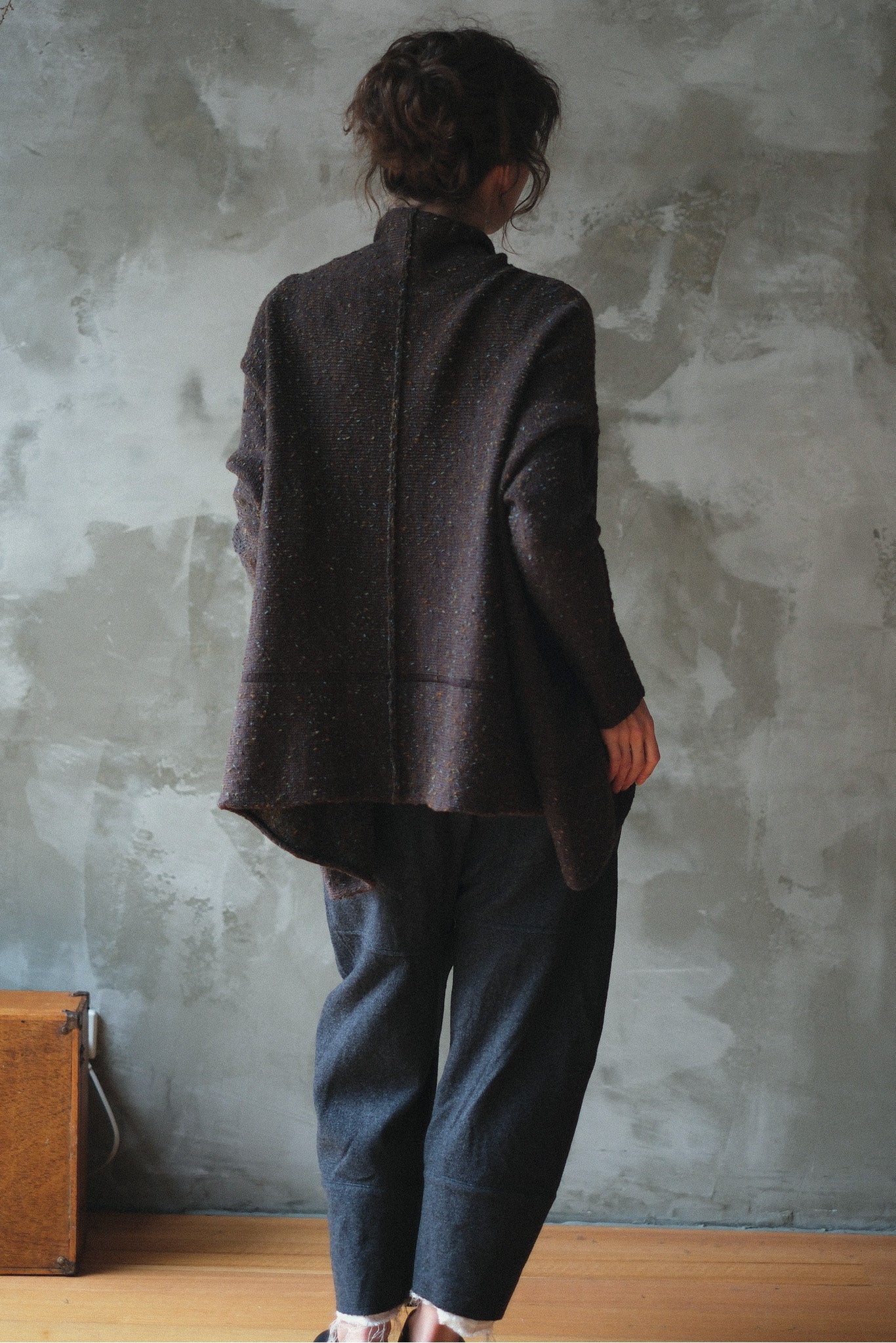 Model wears brown flecked jumper, made from superfine merino wool, designed and made in Melbourne by Wendy Voon knits.