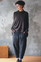 Model wears brown flecked jumper, made from superfine merino wool, designed and made in Melbourne by Wendy Voon knits.