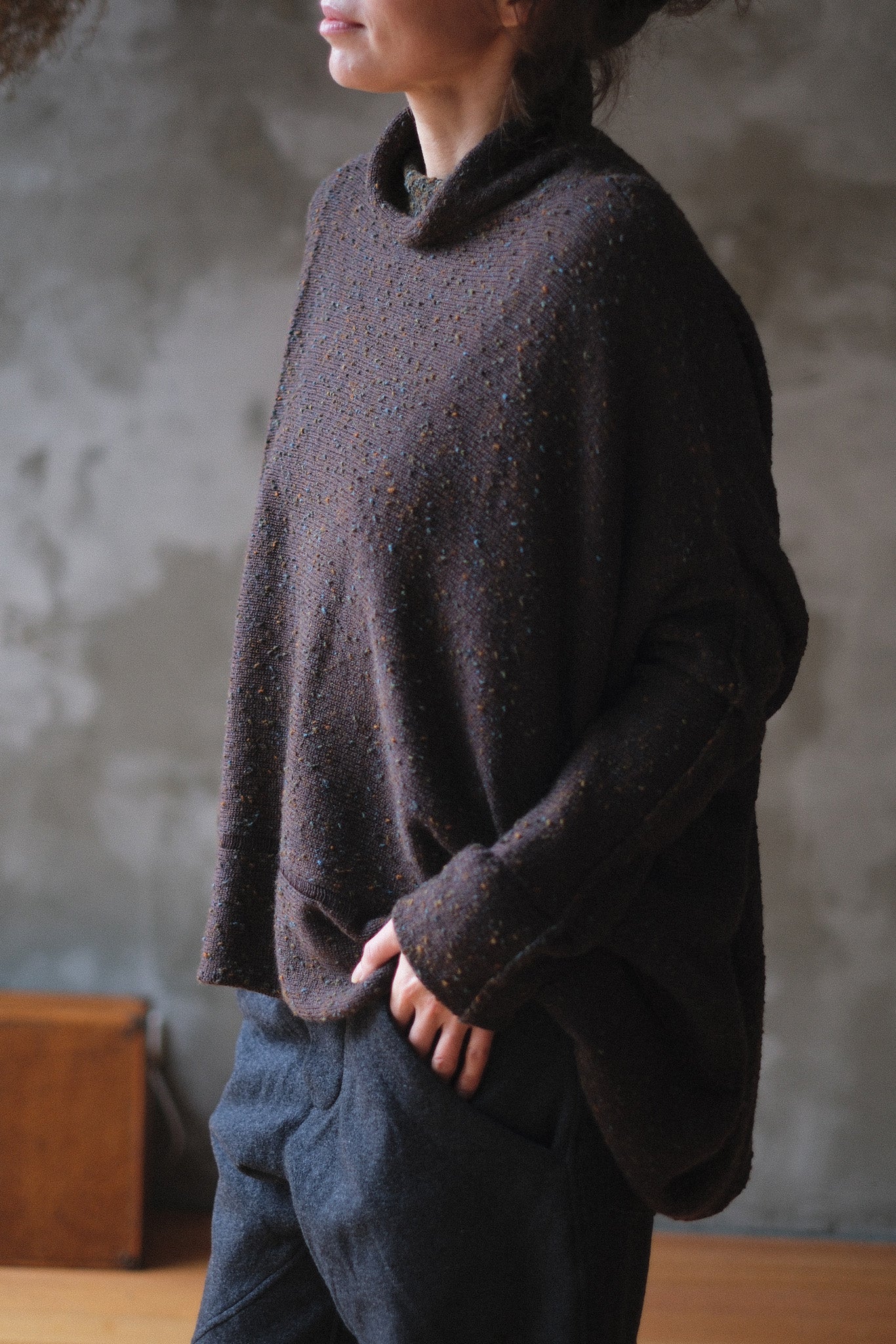Model wears brown flecked jumper, made from superfine merino wool, designed and made in Melbourne by Wendy Voon knits.