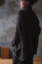 Model wears brown flecked jumper, made from superfine merino wool, designed and made in Melbourne by Wendy Voon knits.