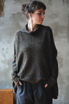 Model wears brown flecked jumper inside out, made from superfine merino wool, designed and made in Melbourne by Wendy Voon knits.