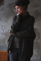 Model wears brown flecked jumper inside out, made from superfine merino wool, designed and made in Melbourne by Wendy Voon knits.