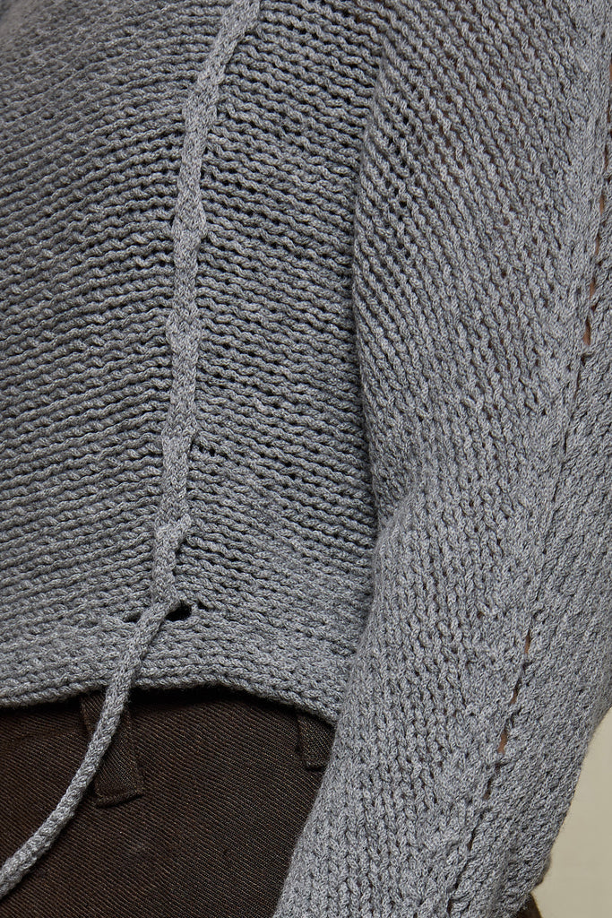 Close up fabric view of loose cord knit batwing in soft grey, designed by Wendy Voon knits and made in Melbourne.