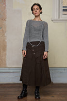 3/4 view of loose cord knit batwing in soft grey, designed by Wendy Voon knits and made in Melbourne.