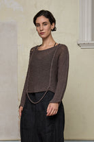 Front view of loose cord knit batwing in mushroom, designed by Wendy Voon knits and made in Melbourne.