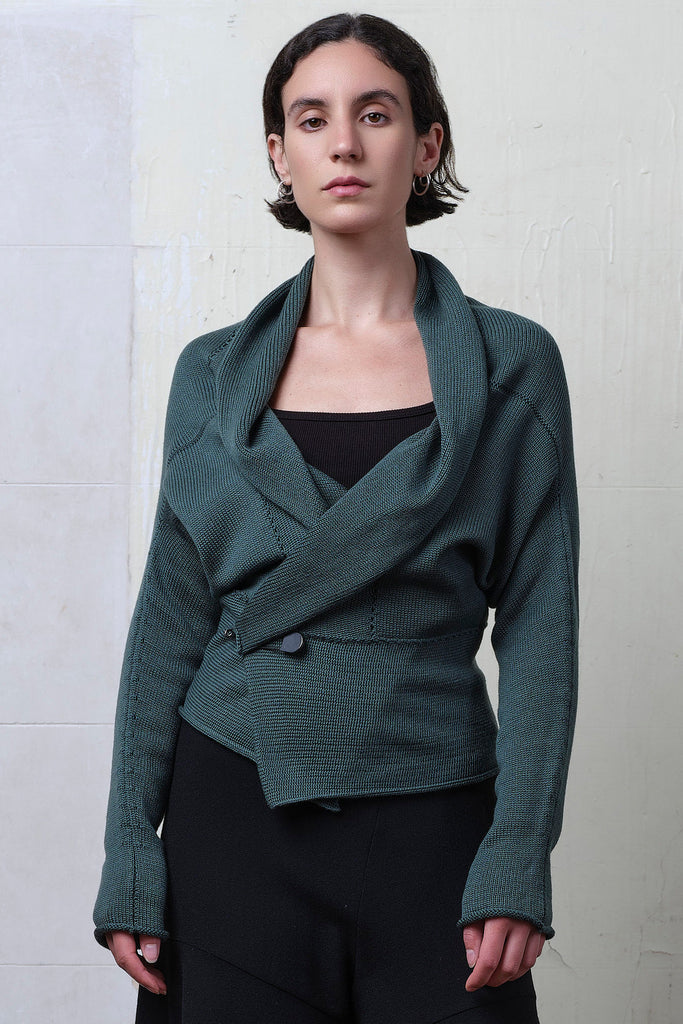 Model wears sage shawl collared knit cardigan. Designed and made in Melbourne by Wendy Voon Knits