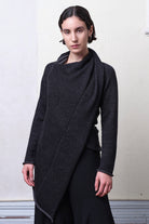 Model wears knitted merino cross over,  in black and charcoal colourway.