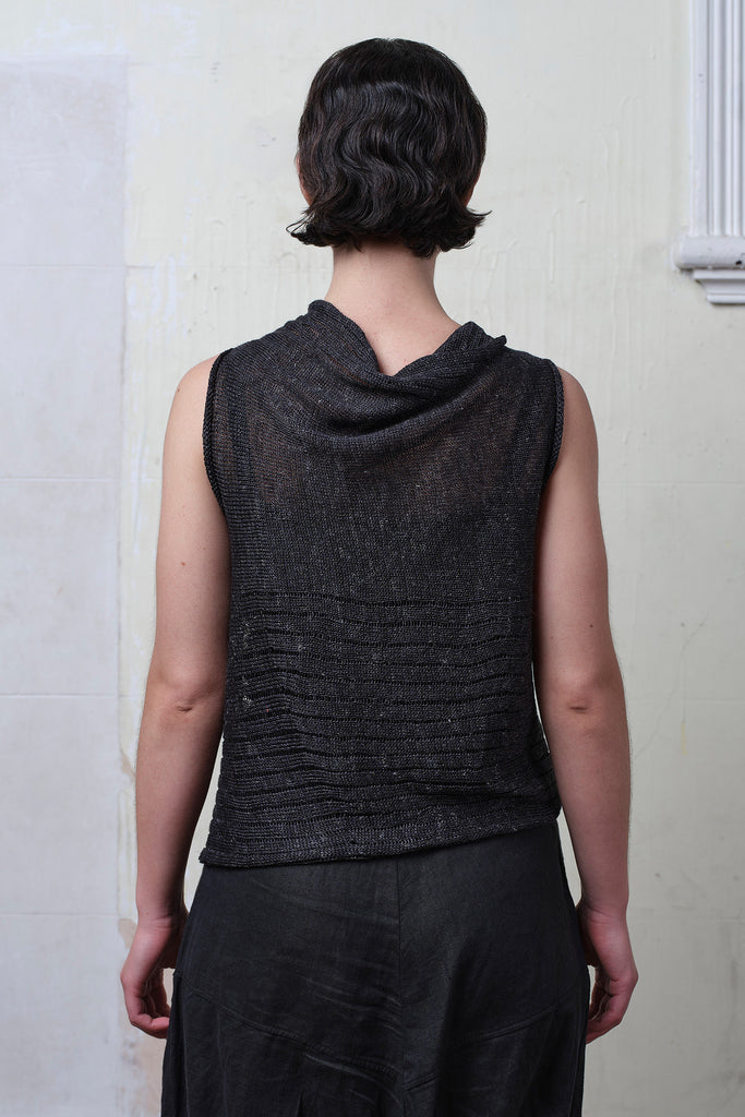 Back view of model wearing charcoal linen laddered vest. Designed and knitted in Melbourne by Wendy Voon knits.