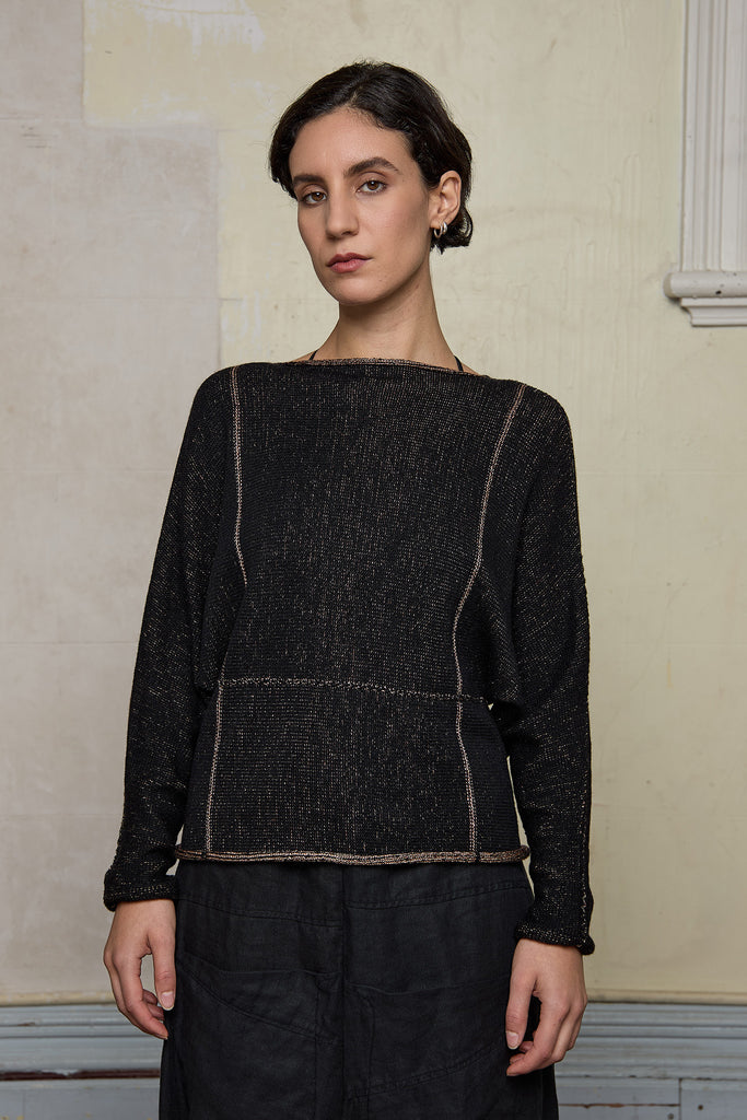 Front view focus on metallic dolmain jumper with pink gold shimmering through black, designed and knitted in Melbourne by Wendy Voon knits