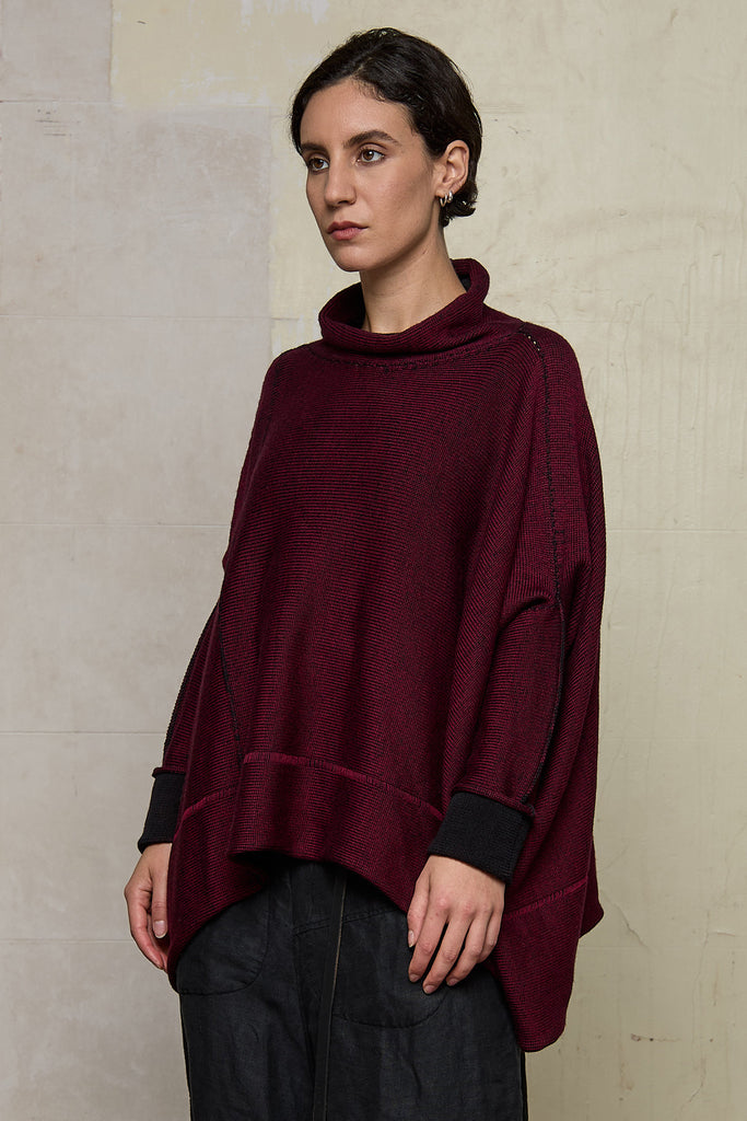 Front view of box shaped jumper designed by Wendy Voon, in a burgundy with black backed fabric, made from superfine merino wool.