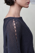 Close up fabric view of Cotton Batwing  in slate colourway, featuring large stitch details,  designed by Wendy Voon knits.