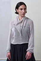 Model wears pearl coloured knitted back scoop jumper in a cotton/linen blend. Designed and knitted in Melbourne by Wendy Voon knits.