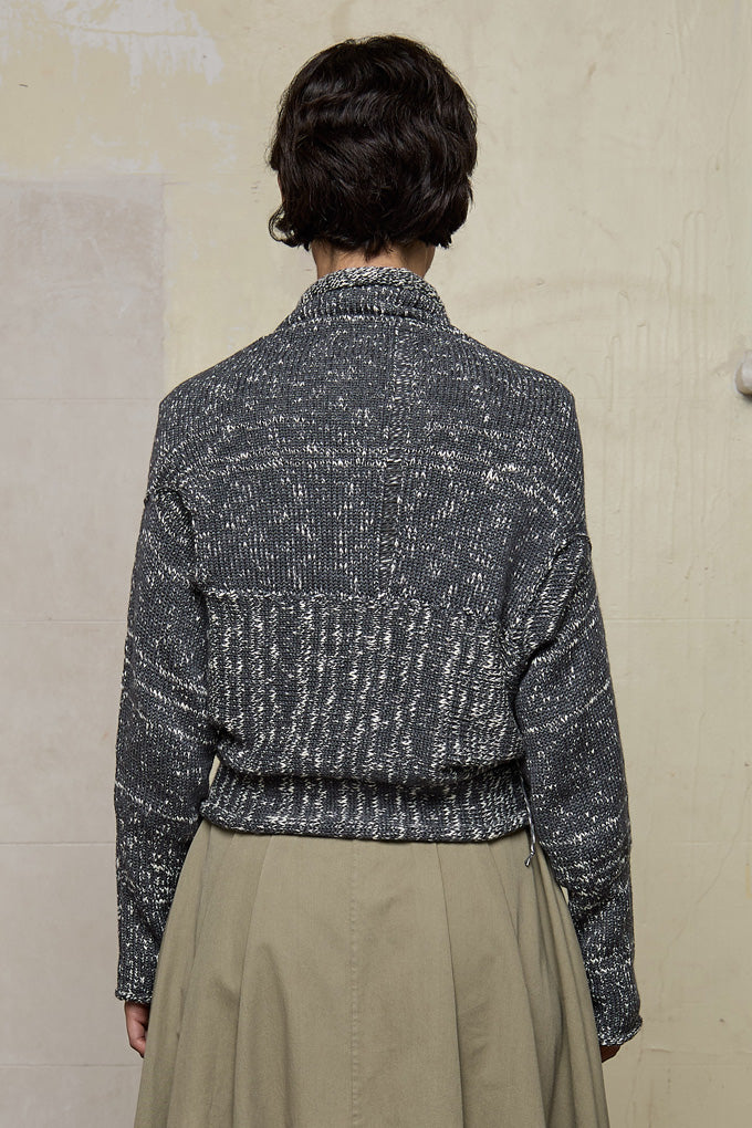Back view of grey flecked chunky knit cardigan, with ruched detail, worn upside down.  Designed and made by Wendy Voon knits