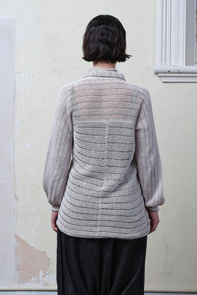 Back view of model wearing cotton/linen laddered knitted jumper in pearl, designed and knitted in Melbourne by Wendy Voon knits.