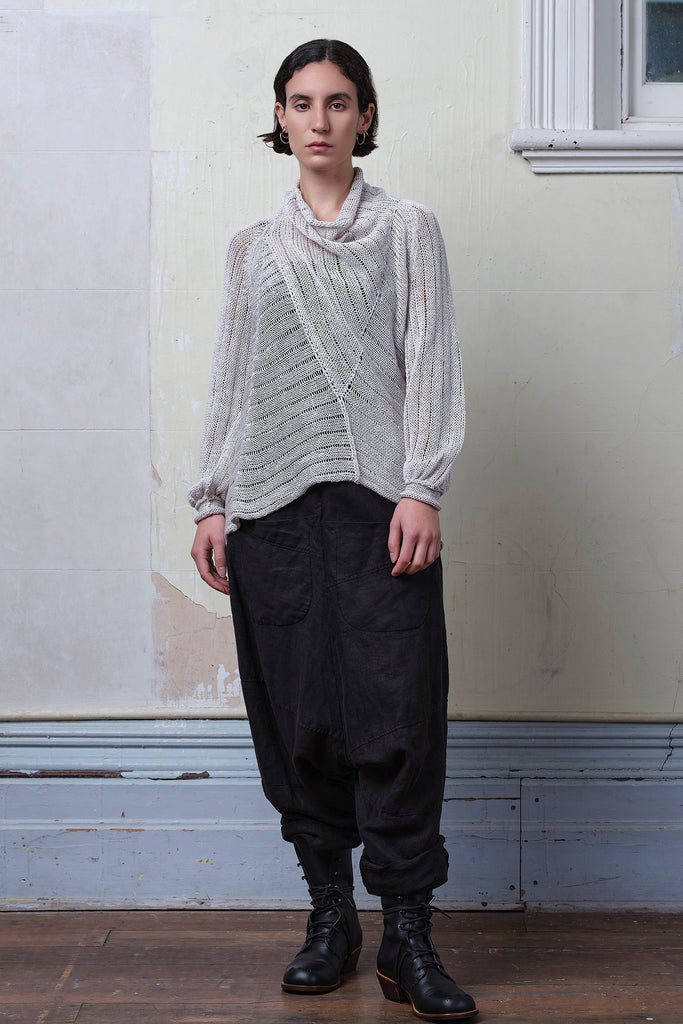 Model wears cotton/linen laddered knitted jumper in pearl, designed and knitted in Melbourne by Wendy Voon knits.