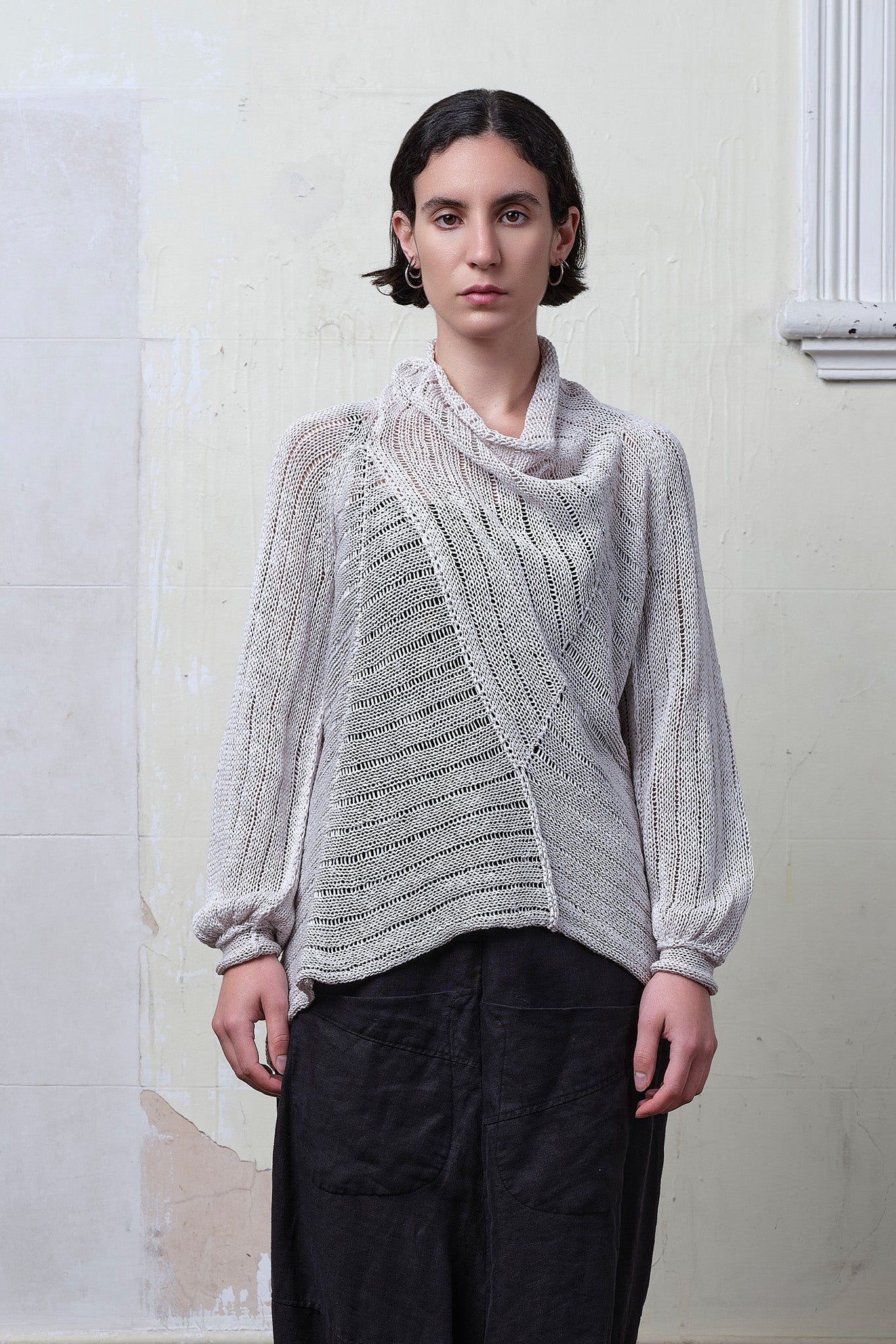 Model wears cotton/linen laddered knitted jumper in pearl, designed and knitted in Melbourne by Wendy Voon knits.