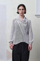 Model wears cotton/linen laddered knitted jumper in pearl, designed and knitted in Melbourne by Wendy Voon knits.
