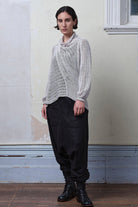 Model wears cotton/linen laddered knitted jumper in pearl, designed and knitted in Melbourne by Wendy Voon knits.