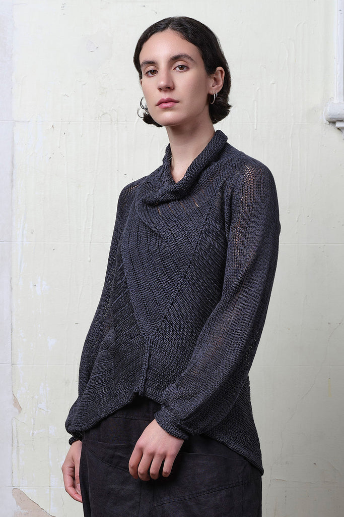 Model wears cotton laddered knitted jumper in slate, designed and knitted in Melbourne by Wendy Voon knits.