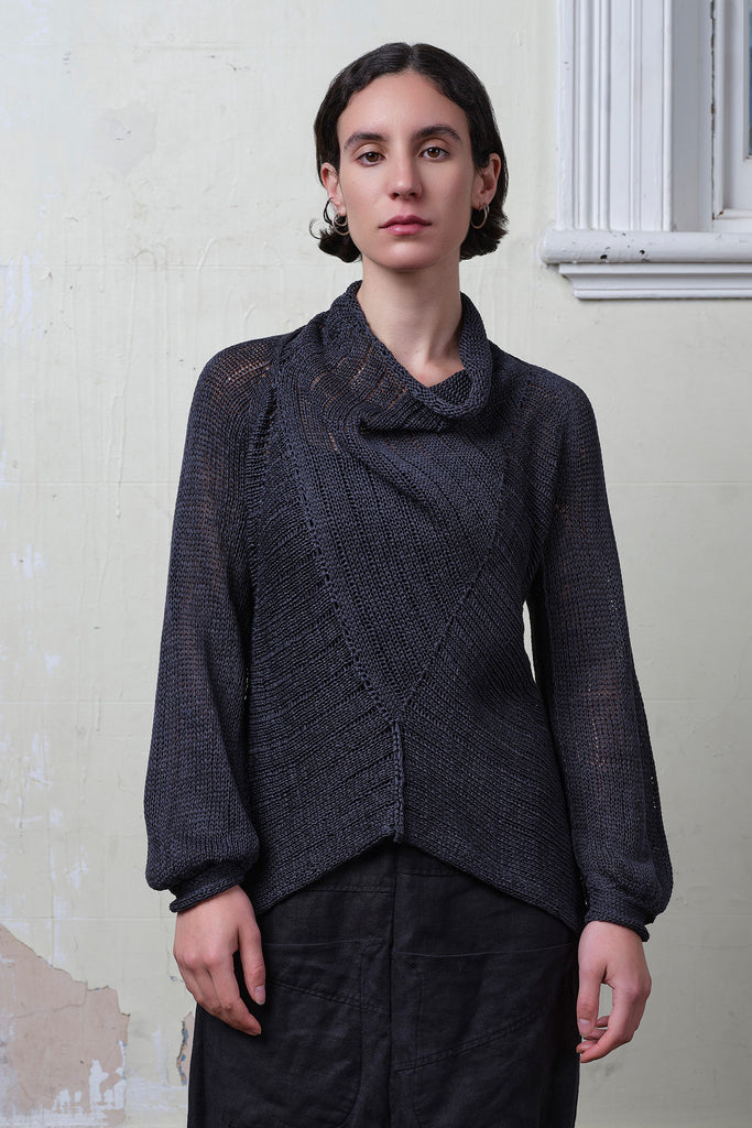 Model wears cotton laddered knitted jumper in slate, designed and knitted in Melbourne by Wendy Voon knits.