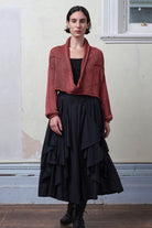 Model wears coral cotton cropped jumper. Designed and knitted in Melbourne by Wendy Voon knits