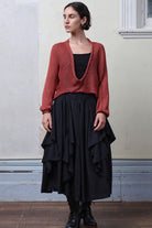 Model wears coral cotton cropped jumper upside down. Designed and knitted in Melbourne by Wendy Voon knits