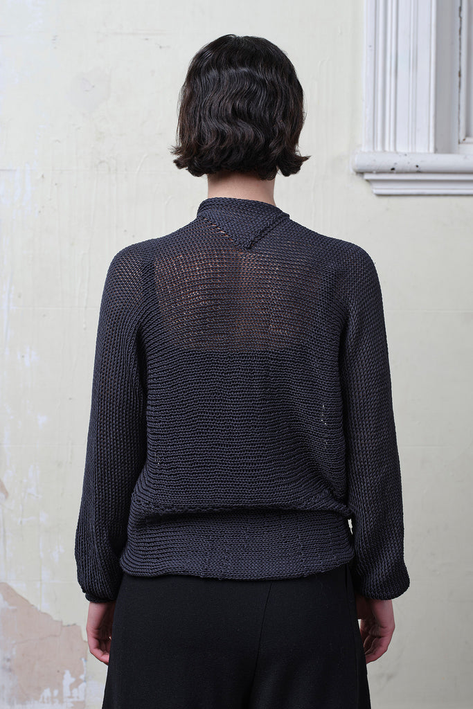 Back view of model wears cotton cropped jumper upside down in slate. Designed and knitted in Melbourne by Wendy Voon knits