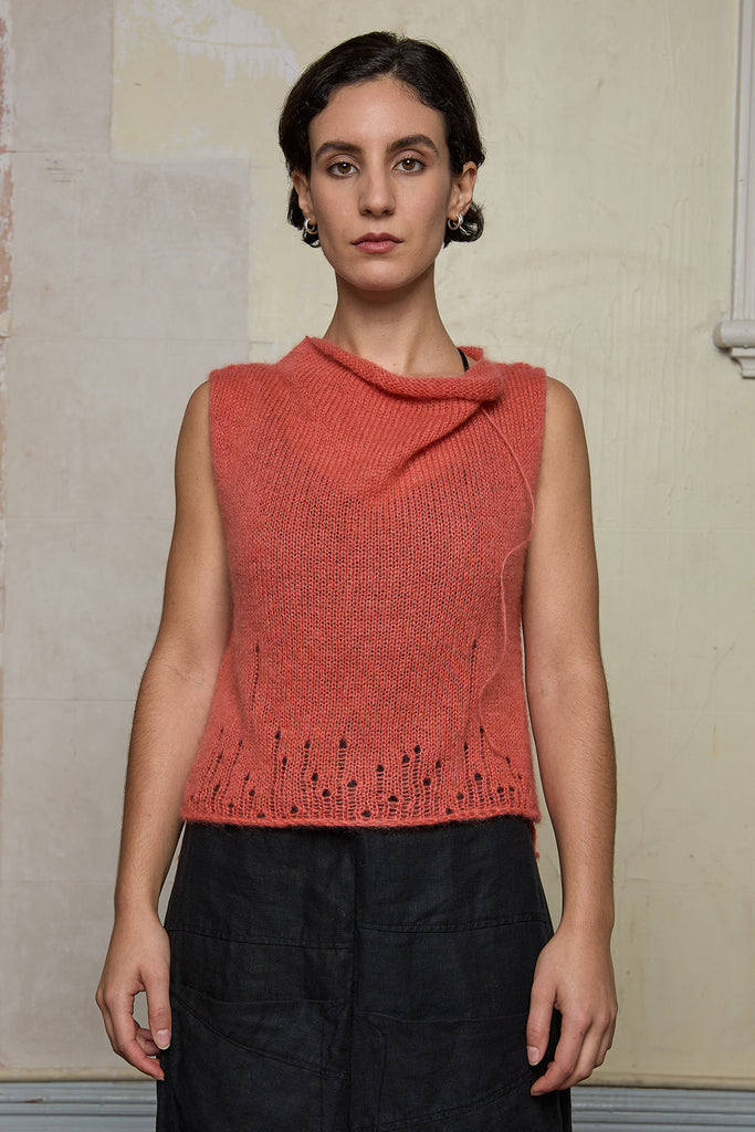 Front view of model wearing super lush knitted vest in carrot colourway, designed and knitted in Melbourne by Wendy Voon knits 