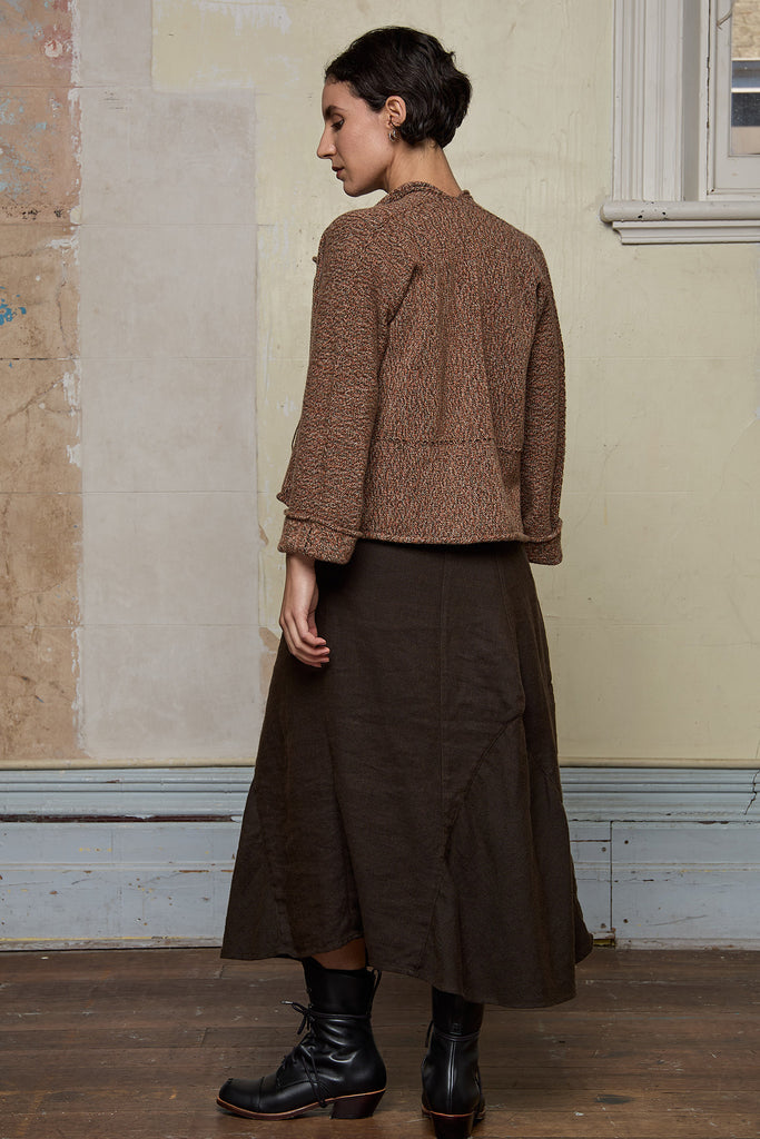Back view of knitted wool cropped jacket in rust, army and cream melange, designed by Wendy Voon, knitted in Melbourne.
