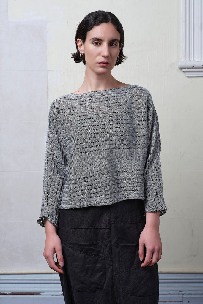 Model wears linen/cotton batwing in silver grey backed with black colourway. Designed and knitted in Melbourne  by Wendy Voon knits