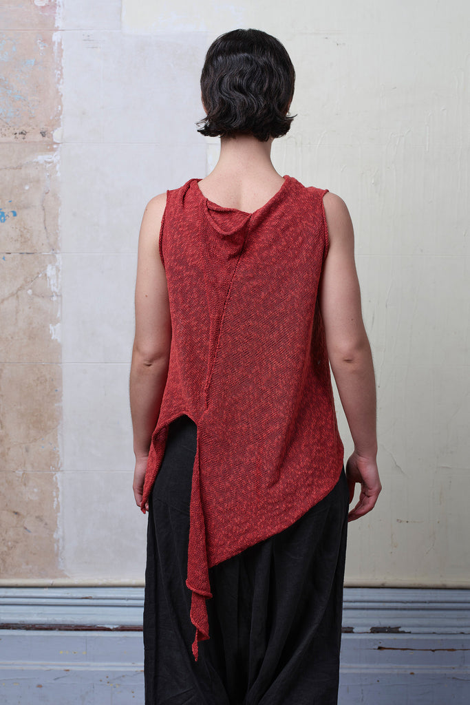 Model wears textured cotton/linen self curling vest in coral colourway. Designed and knitted in Melbourne, by Wendy Voon knits.