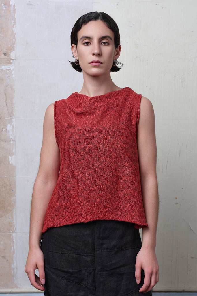 Model wears textured cotton/linen self curling vest in coral colourway. Designed and knitted in Melbourne, by Wendy Voon knits.