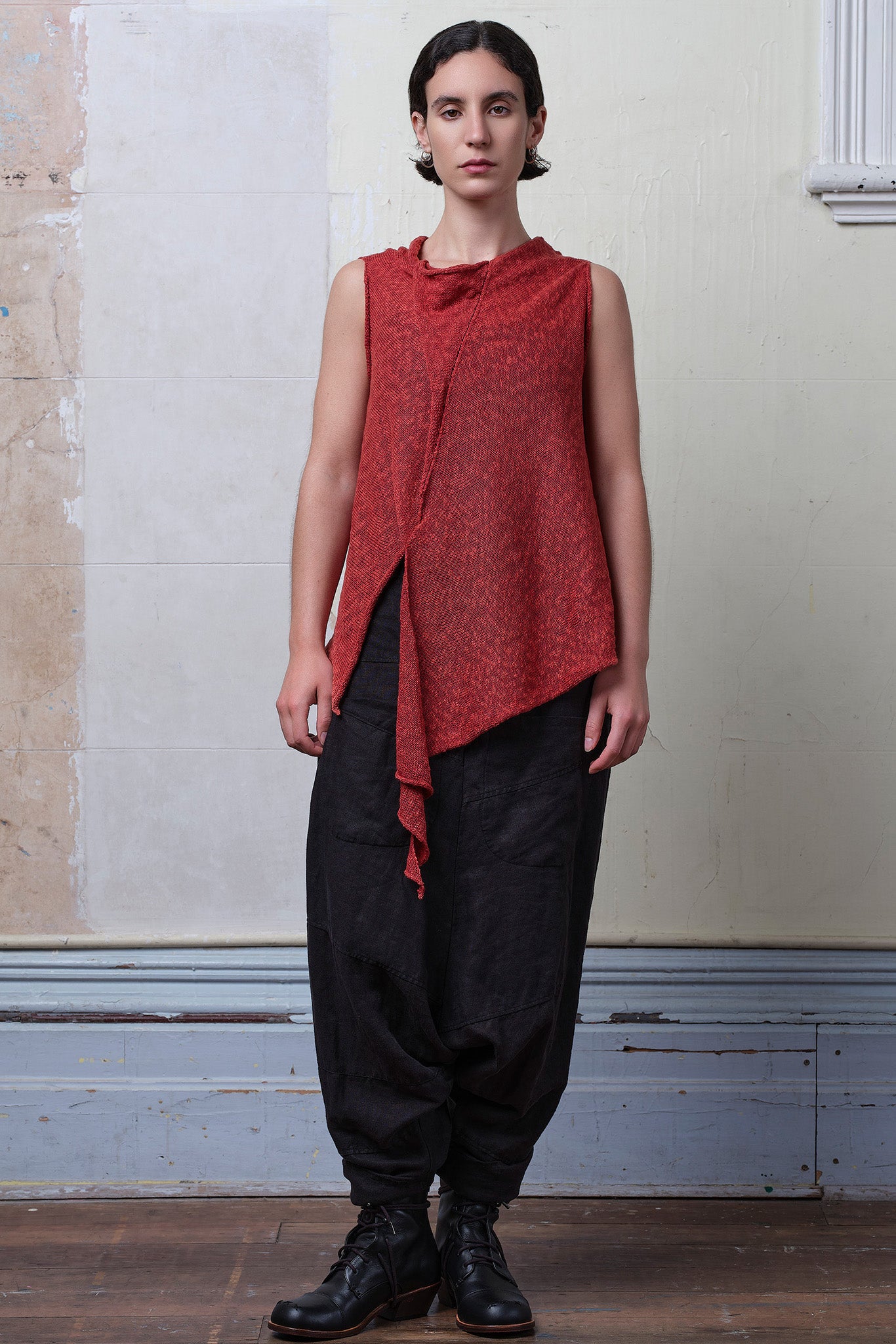 Model wears textured cotton/linen self curling vest in coral colourway. Designed and knitted in Melbourne, by Wendy Voon knits.