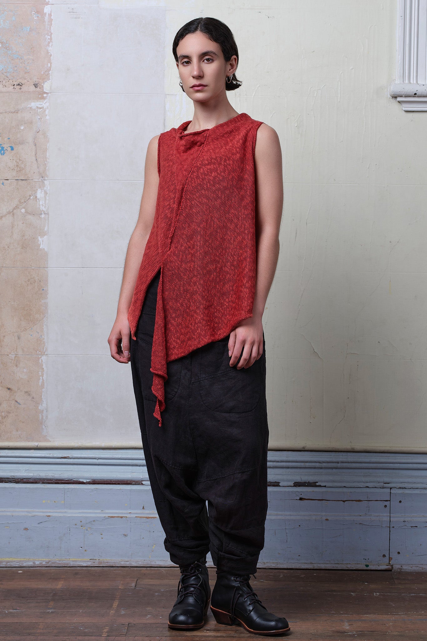 Model wears textured cotton/linen self curling vest in coral colourway. Designed and knitted in Melbourne, by Wendy Voon knits.