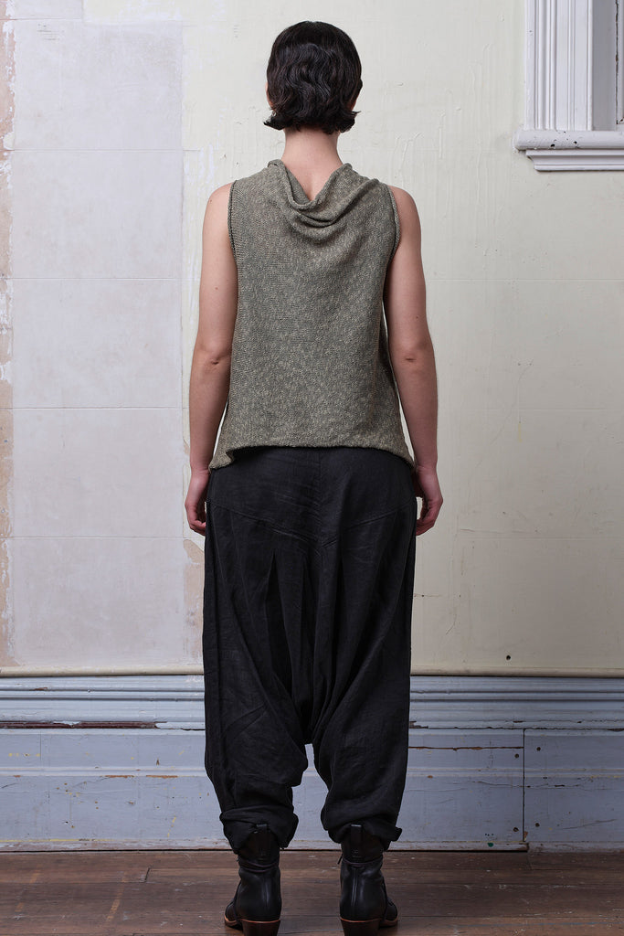 Model wears textured cotton/linen self curling vest in lichen colourway. Designed and knitted in Melbourne, by Wendy Voon knits.