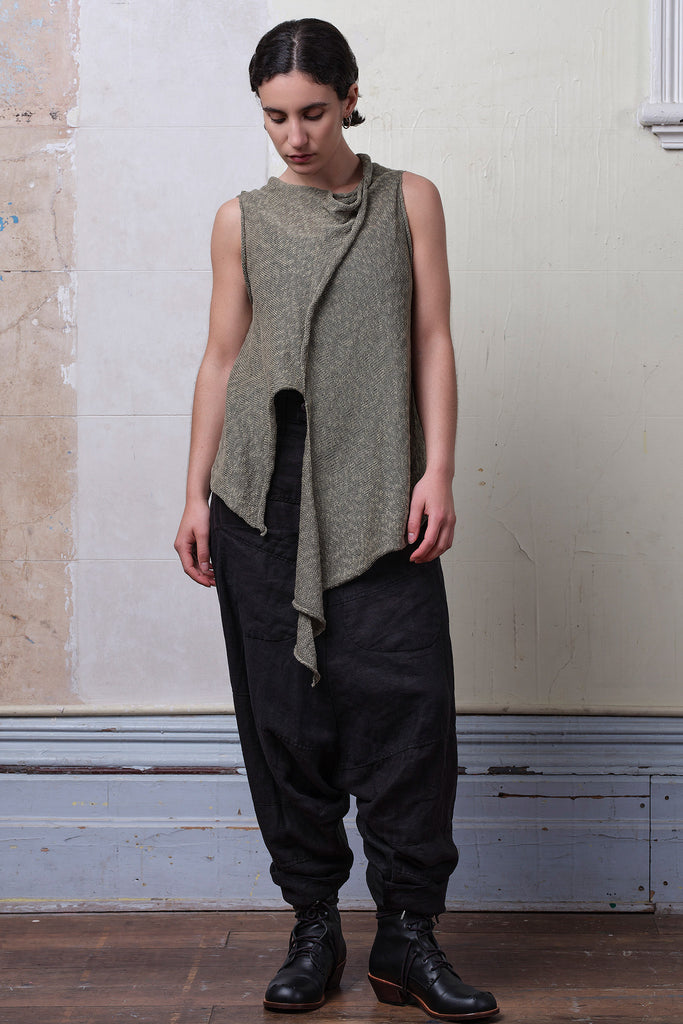 Model wears textured cotton/linen self curling vest in lichen colourway. Designed and knitted in Melbourne, by Wendy Voon knits.