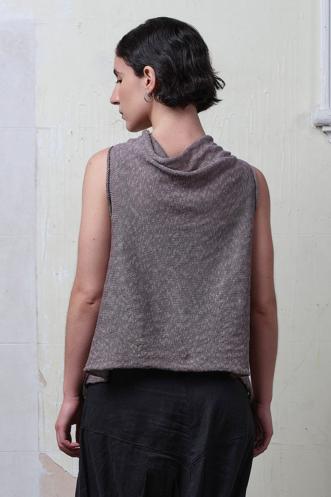 Model wears textured cotton/linen self curling vest in mushroom colourway. Designed and knitted in Melbourne, by Wendy Voon knits.