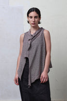 Model wears textured cotton/linen self curling vest in mushroom colourway. Designed and knitted in Melbourne, by Wendy Voon knits.