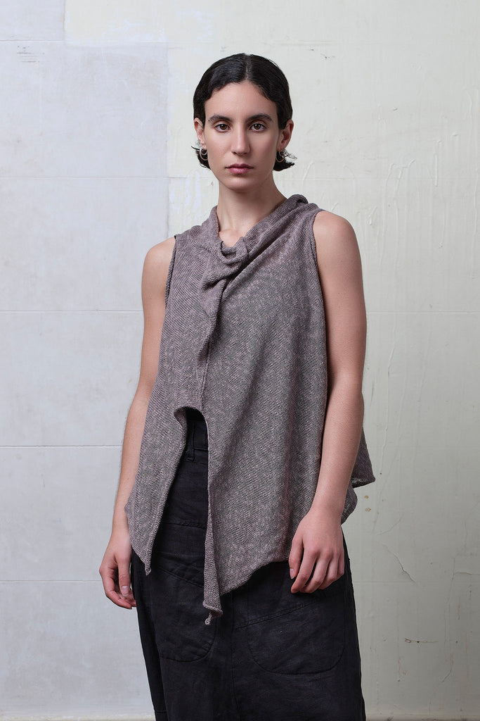 Model wears textured cotton/linen self curling vest in mushroom colourway. Designed and knitted in Melbourne, by Wendy Voon knits.