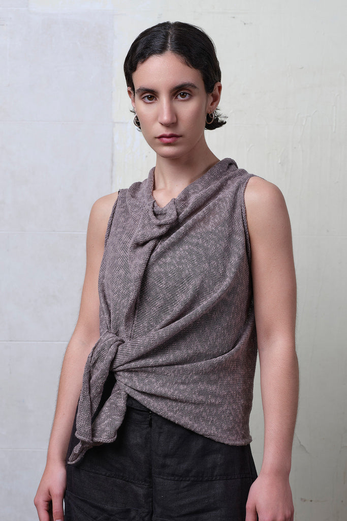 Model wears textured cotton/linen self curling vest in mushroom colourway. Designed and knitted in Melbourne, by Wendy Voon knits.