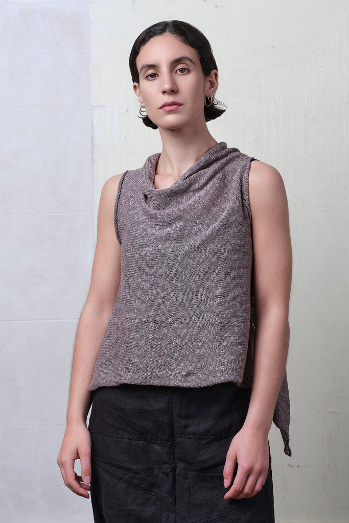 Model wears textured cotton/linen self curling vest in mushroom colourway. Designed and knitted in Melbourne, by Wendy Voon knits.