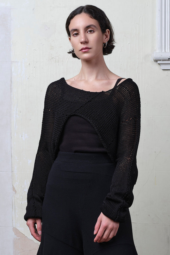 Model wears black cotton cropped jumper upside down. Designed and knitted in Melbourne by Wendy Voon knits