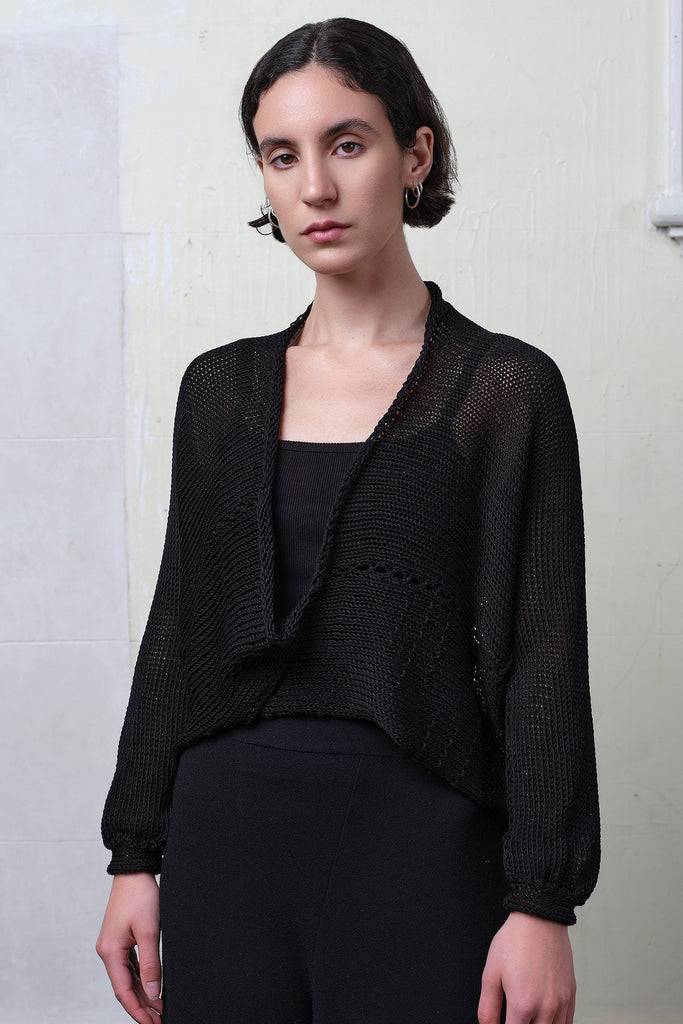 Model wears black cotton cropped jumper upside down. Designed and knitted in Melbourne by Wendy Voon knits