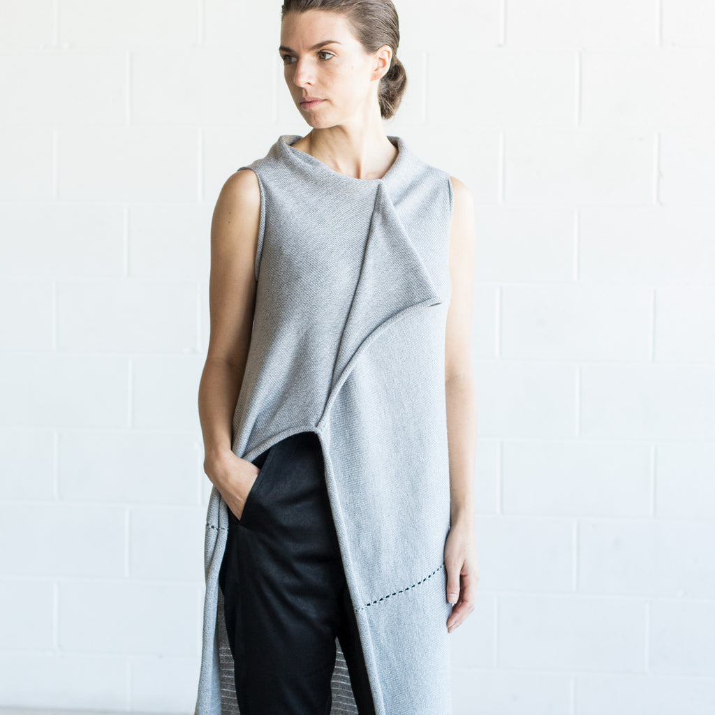 Front detail view of Asymmetric Longline vest design by Wendy Voon knits in silver grey melange merino wool