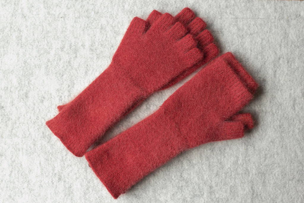 Raspberry coloured fingerless gloves and sloves, knitted in an angora and lambswool blend